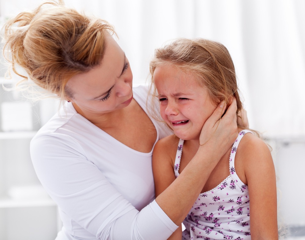 Mother comforting her crying child