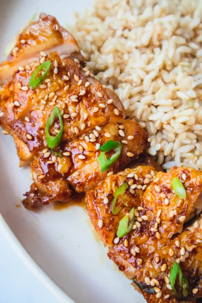 Teriyaki chicken on a plate with rice