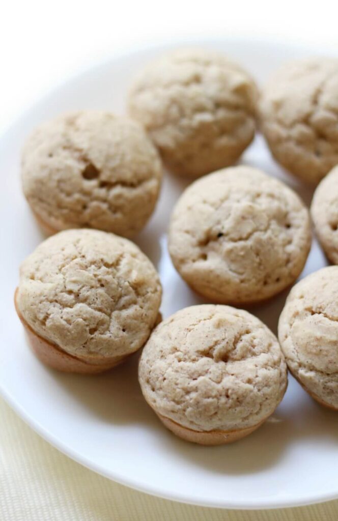 Mini muffin-like pancake bites arranged in a circle on a plate